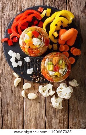 Spicy Homemade Pickled Giardiniera With Peppers, Carrots And Cauliflower. Vertical Top View