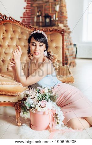 Photo of beautiful young woman with makeup in fashion clothes