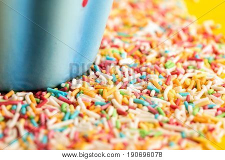 Multicolored Pastel background or colorful texture with top view. Pastel tasty fluffy sweet mini marshmallows. Minimal summer holiday style. Funny tasty cake.
