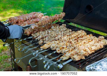 Grilled meat roasted skewers barbecue. Barbeque churrasco meat background. Appetizing meat roasted BBQ grill.
