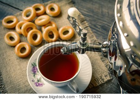 Tea from a samovar with sweet pastries. Selective focus