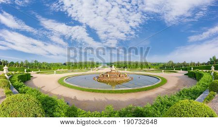 Panorama of the Gardens of Versailles with the Latona Fountain in the foreground and the Grand Canal in the background on a spring morning France