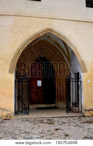 Gate. Old medieval saxon lutheran church in Sighisoara, Transylvania, Romania