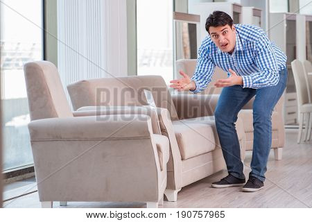 Young man shopping in furniture store