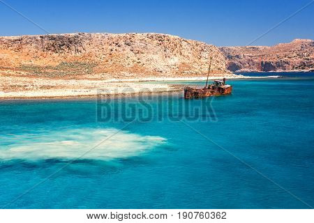 rusting shipwreck at the seaside near by Crete island