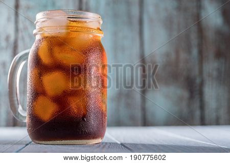 Cold brew coffee or black tea in a mason jar