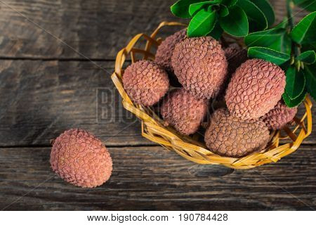 Lychees exotic fruits on a wooden background