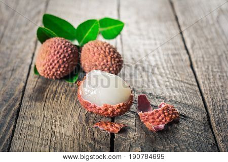 Lychees exotic fruits on a wooden background