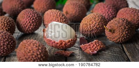 Lychees exotic fruits on a wooden background