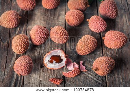 Lychees exotic fruits on a wooden background