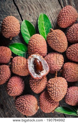 Lychees exotic fruits on a wooden background
