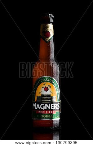 London, Uk - June 9, 2017: Bottle Of Magners Original Irish Cider On Black.