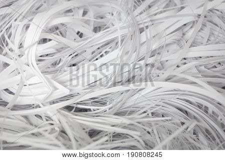 Shredded paper series - confidentiality. Cut into strips classified documents. Shredded documents.