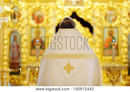 Orthodox christian priest in church close-up photo