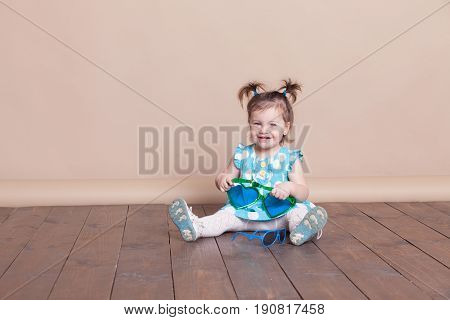 Little Girl Plays With Big Glasses, She Is Funny