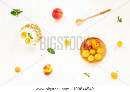 Fresh Summer Fruit. Healthy Breakfast With Peach, Nectarine, Apricot, Muesli, Peach Yogurt, Mint, Ce