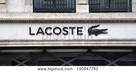 LONDON - AUGUST 6: A London Lacoste store logo is shown here on August 6 2015. Lacoste saw sales of 1.95 billion euros in 2015.