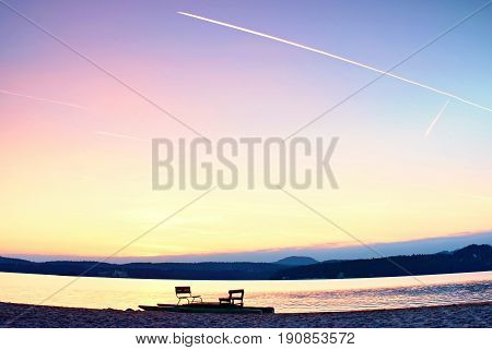 Abandoned Old Rusty Pedal Boat Stuck On Sand Of Beach. Wavy Water Level, Island On Horizon. Autumn S