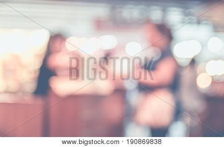 Blurred backgroundPeople in Coffee shop with bokeh light