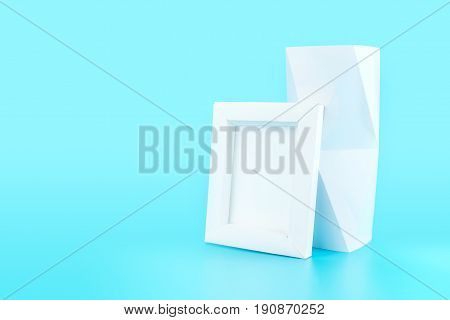 White Photo Frame(made From Paper) And Polygon Vase On Light Blue Background,leave Space For Adding