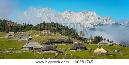 Mountain village in Alps, wooden houses in traditional style. Velika Planina, Kamnik, Slovenia