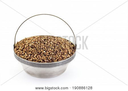 Buckwheat Groats In Antique Silver Pial On A White Background