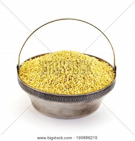 Dry Millet In Silver Bowl Isolated On White. Spilled Millet.