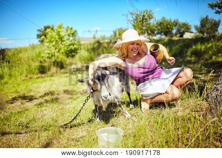 Funny picture a beautiful young girl farmer with in Hat
