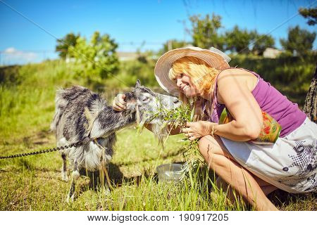 Funny picture a beautiful young girl farmer with in Hat