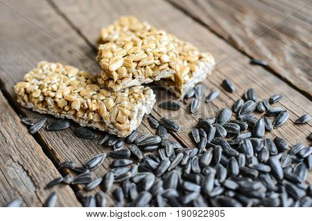 Kozinak from sunflower seeds on wooden background