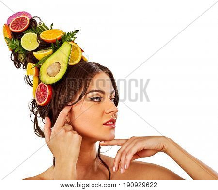 Hair and facial mask from fresh fruits for woman concept. Girl care her skin homemade by dint of organic therapy on isolated. Woman in profile is testing new diet with vitamins for hair.