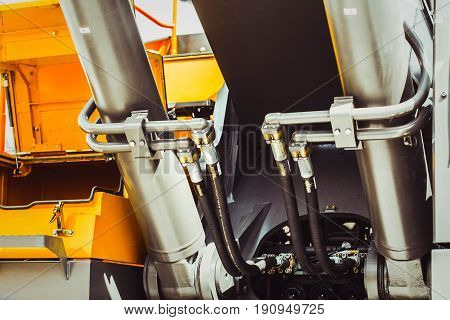 The hydraulic tractor is yellow. Crawler bulldozer at the exhibition