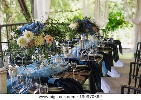 Empty wine glasses on the background of the decorated table. Wedding subjects. Registration Wedding dinner.