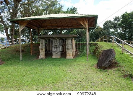 An ancient burial site guarded by statues in San Agustin archaeological park Colombia