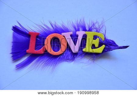WORD LOVE ON A  ABSTRACT COLORFUL BACKGROUND