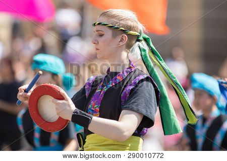 Washington, D.C., USA - April 14, 2018 Okinawan Taiko Drummers of Wisconsin playing traditional Okinawan music in the 2018 National Cherry Blossom Parade