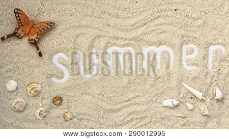 Summer White Letters With Butterfly And Seashells On Sandy Background. Summer Flatlay.