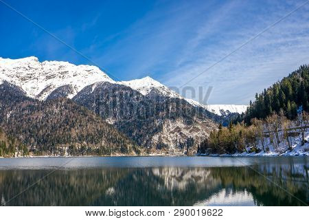 Beautiful View Of The Mountains Covered With Forest And The Lake In The Caucasus In Abkhazia