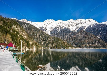 Mountain And Snow Covered Mountain Peaks Around Lake Ritsa In Abkhazia