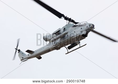 Louisville, Kentucky, USA - April 21, 2018 AH-1 Cobra attack helicopter from the Marine Corps does a fly by at the Thunder Over Louisville