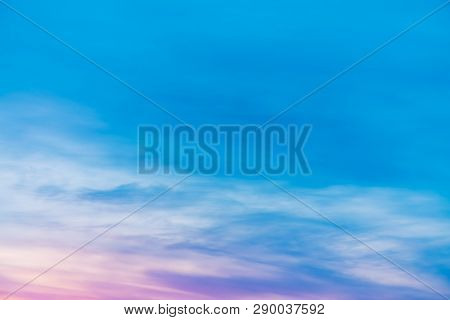 Sunset Sky With Pink Lilac Light Clouds. Colorful Smooth Blue White Sky Gradient. Natural Sunrise Ba