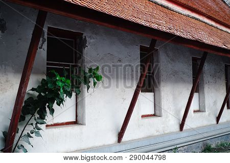 Windows And Oriental Style Roof Of Surrounding Building At Kalayanamitr Temple, Bangkok.