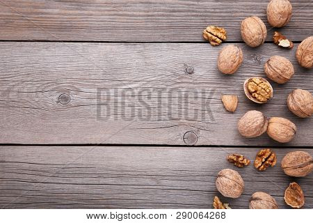 Walnuts Kernels On Grey Wooden Background. Walnuts Kernels On Grey Wooden Table