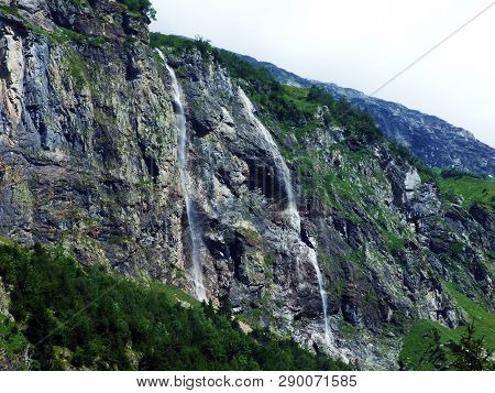 Waterfall Milchbachfall Or Wasserfall Milchbachfäll, Milchbäch Stream In The Alpine Valley Of Madera
