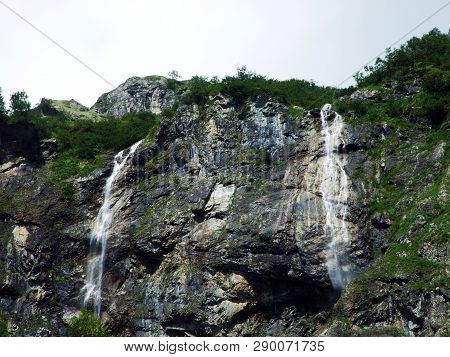 Waterfall Milchbachfall Or Wasserfall Milchbachfäll, Milchbäch Stream In The Alpine Valley Of Madera