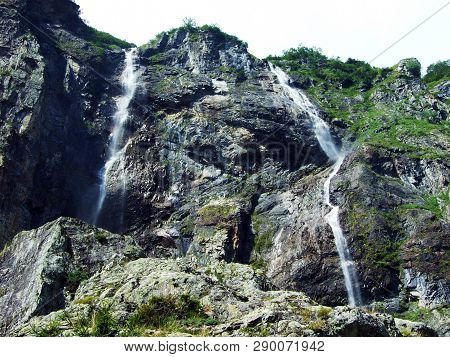 Waterfall Milchbachfall Or Wasserfall Milchbachfäll, Milchbäch Stream In The Alpine Valley Of Madera