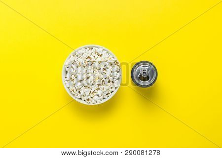 Bowl With Popcorn And A Can With A Drink On A Yellow Background. The Concept Of Watching Movies And 