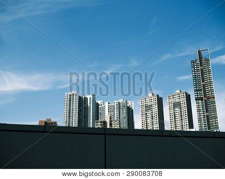 View Of High-rise Buildings Around Happy Valley, Hong Kong, With Blue Sky In Background