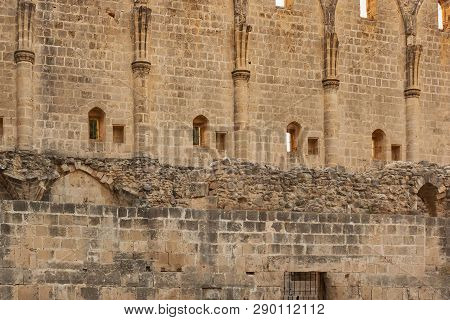 Old Stone Walls Of The Abbey Of Bellapais In The Northern Cyprus. Bellapais Abbey Is The Ruin Of A M