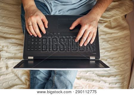 Top View Of Male Hands Using Modern Laptop, Close Up Of Young Man Working At Home And Using Notebook